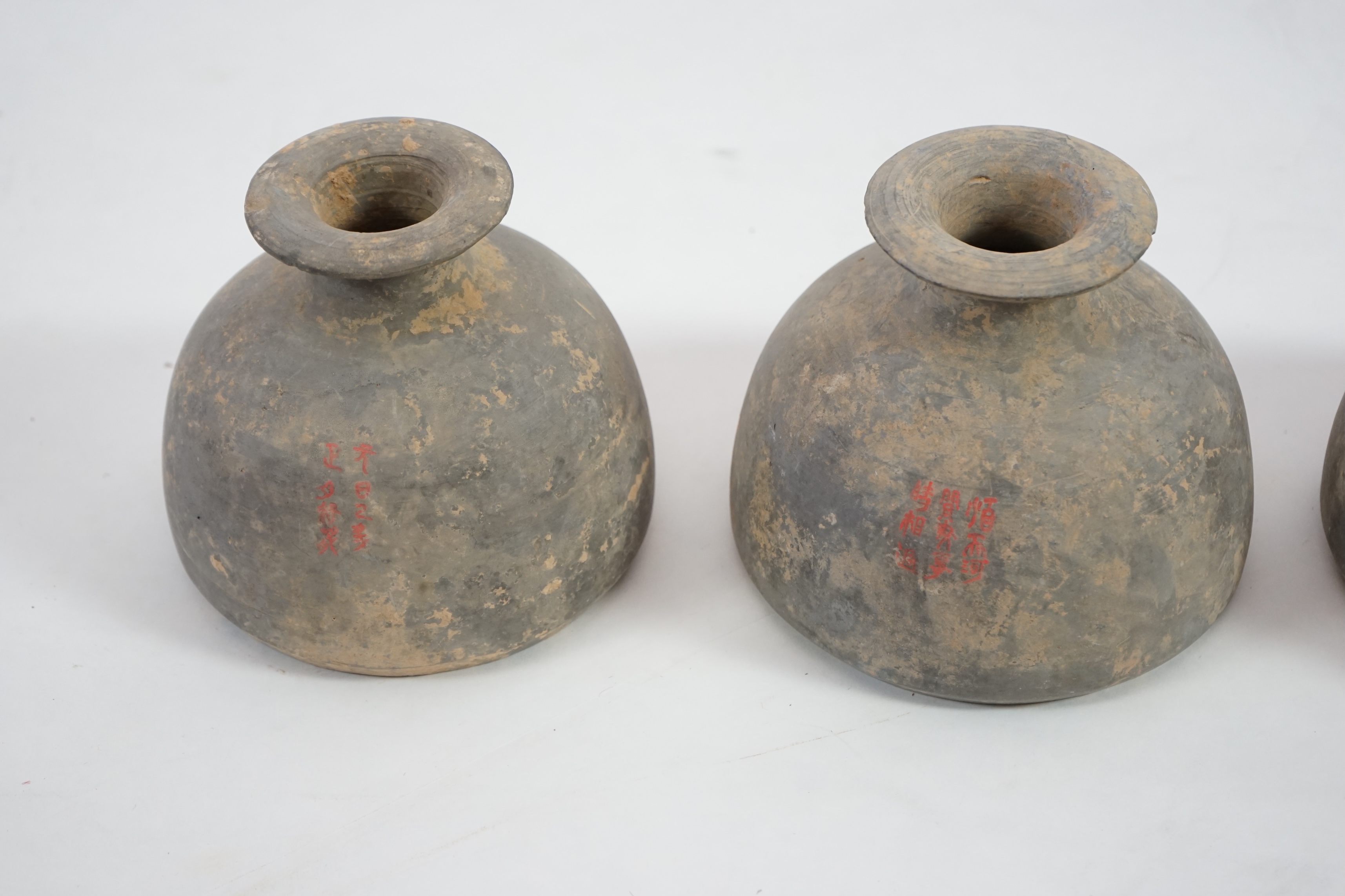 Four very rare Chinese inscribed pottery jars, Han dynasty